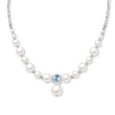 Drape your neck in elegant style when you wear this pearl and gleaming metal necklace. Every pearl in this necklace has been carefully selected for its radiant luster and smooth surface, ensuring a luxurious and refined appearance. A breathtaking aquamarine blue round-cut stone encircled by gleaming metal, a touch of glamour and brilliance to the ensemble. Embrace the fusion of traditional and contemporary, and make a lasting impression wherever you go.Thickness: 410-500 mmPlating Color: Silver Metal Necklace, Classic Necklace, Aquamarine Blue, Cool Necklaces, Anniversary Sale, Metal Necklaces, Quality Jewelry, Earring Necklace, Watch Design