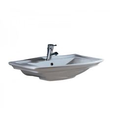 a white bathroom sink with faucet and chrome faucet on the side