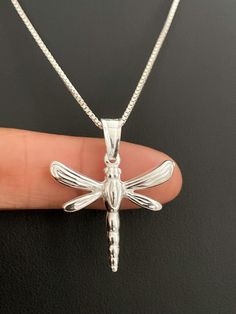 "Minimalist and Dainty Sterling Silver Dragonfly Pendant Necklace NECKLACE FEATURES: Metal: All components are made from solid .925 Sterling Silver Model is wearing 16\" in length solid .925 Sterling Silver Chain Length available: 16\", 18\" or 20\" Measurement: Sterling Silver Dragonfly Pendant Height: 28 mm (1.1 inches) Please send me a message if you have any questions before or after placing your order. Please also view my policy before purchasing. Please visit my storefront to view more of Silver Model, Boho Chic Necklace, Accessory Ideas, Dragonfly Charm, Dragonfly Necklace, Insect Jewelry, Chic Necklace, Dragonfly Pendant, Necklace Necklace