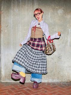 Skirt On Jeans, Plaid On Plaid Outfit, Maximalist Layering Outfit, 80s Maximalism Fashion, Jeans And Skirt Outfit, How To Layer Skirts, Back Skirt Outfit, Pattern On Pattern Outfit, Cool Layered Outfits