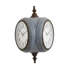 an old fashioned clock with two faces and numbers on each face, hanging from a metal pole