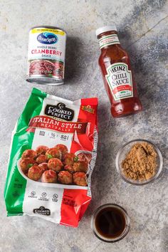 ingredients to make italian meatballs laid out on a counter top with sauces and seasonings