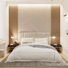 a large white bed sitting in a bedroom next to a wooden floor and wall mounted lamps