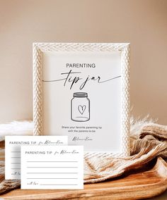 a card with a jar on it next to a wooden tray