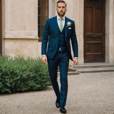 a man in a blue suit is walking down the street with his hand in his pocket