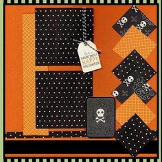 an orange and black halloween scrapbook cover with skulls, bones and crossbones