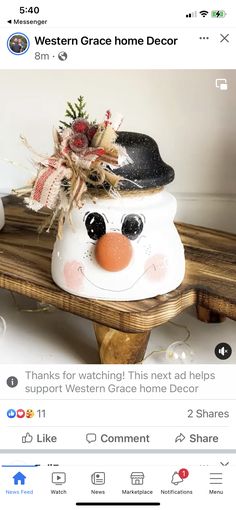 a wooden bench with a snowman decoration on it's top and the words western grace home decor below