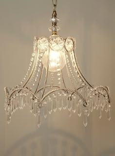 a chandelier hanging from the ceiling in a room