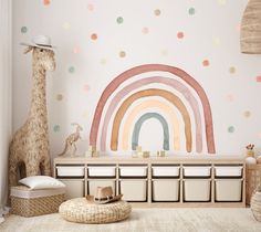 a child's room with a rainbow wall decal