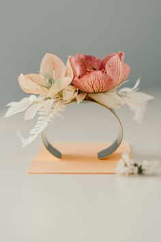 an arrangement of flowers in a vase on a table