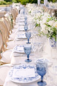 a long table set with blue and white china