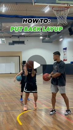 two people are playing basketball on an indoor court with the words how to put back layup