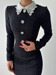 This elegant black tweed mini dress is a timeless piece of clothing that combines vintage charm with modern sophistication. Crafted from a textured tweed fabric with subtle shimmer, this dress features long sleeves and a fitted silhouette, flattering the waist and creating a classic hourglass shape. The front is adorned with three statement crystal buttons that add a touch of glamour. A standout detail is the intricate white lace collar, adding a delicate, vintage-inspired accent. Perfect for formal events, business gatherings, or an elevated day look, this dress combines elegance and style effortlessly. The model is wearing S/36 size and has measurements: Height: 1.73 Chest: 78 Waist: 63 Hip: 88 Please, note that we don do refunds or returns for wrong choosen size by you! Women Black Dress, White Lace Collar, Black Dress With Lace, Tweed Mini Dress, Events Business, Crystal Buttons, Hourglass Shape, Black Tweed, Tweed Fabric