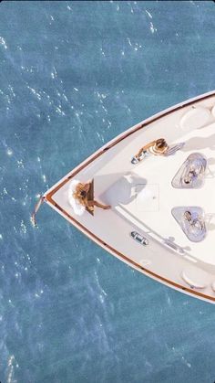 an aerial view of a small boat in the water