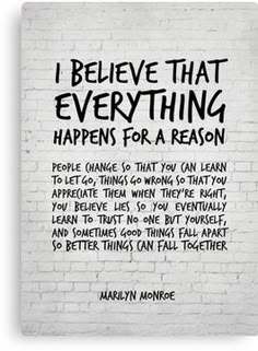 marilyn monroe quote on white brick wall with black lettering that says i believe that everything happens for a reason