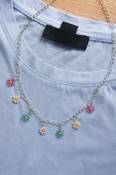 a necklace with flowers hanging from it