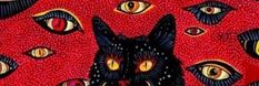 a black cat with yellow eyes is on red fabric, which has many different designs