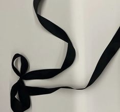 a black ribbon is hanging on the wall