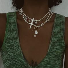 Midori is handcrafted with genuine freshwater pearls and gold filled hardware. This asymmetrical necklace has a unique pearl cross focal point. The perfect everyday pearl statement piece! *16.5” shown on model *please allow for variation in color/shape with natural gemstones/pearls as they are sisters and not twins. FINAL SALE Handle + Care: Show love to your Filosophy pieces by rinsing them with fresh water if you go swimming in them. To keep your Filosophy pieces in original, top condition, re Asymmetrical Necklace, Jewellery Photography, Go Swimming, Boho Choker, Show Love, Baroque Pearl Necklace, Stone Wrapping, Neck Jewellery, Funky Jewelry