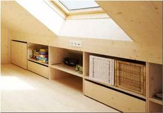 a room with some shelves in it and a skylight