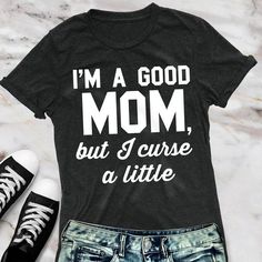 "I'M A GOOD MOM, But I Curse a Little" Unisex Fit T-Shirt - Pick ColorMakes a great Mother's Day Gift!These run on the larger side for women, as they are a unisex fit. We recommend ordering a size down if you prefer a fitted shirt style.Color: Black, or GraySizes: XS, S, M, L, XL, XXLCotton & Polyester BlendVery Soft and ComfortableCotton/Poly Blend If you are looking to do a custom order in this style, please feel free to message us. *photo props not included Good Mom, Clothing Projects, Christmas Party Shirts, Football Mom Shirts, Mother Shirts, Fitted Shirt, Funny Mom Shirts, Mothers Day Shirts, One Piece For Women