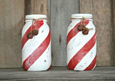 two red and white mason jars with brown buttons