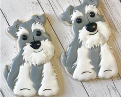 two cookies shaped like dogs sitting next to each other