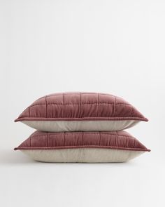 two pillows sitting on top of each other