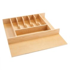 a wooden drawer with several compartments in it