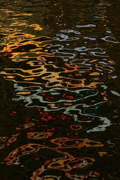 the reflection of buildings in the water is very colorful and interesting to see on this photo