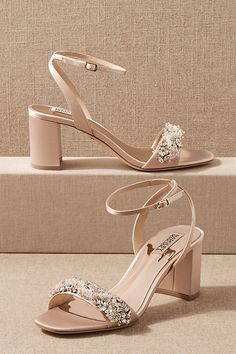 a pair of women's high heeled sandals with jewel embellishments