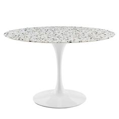 a white table with black dots on it and an oval shaped base, against a white background