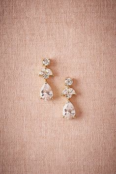 two pairs of earrings with crystal stones