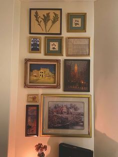 there are many framed pictures on the wall