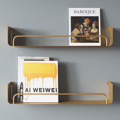 two metal shelves with books and magazines on them