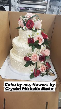 there is a cake with flowers on it in a box that says cake by me, flowers by crystal michele bake