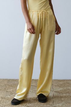 The Silk Drawstring Pant is crafted from our luxe 100% silk charmeuse fabric. Featuring a drawstring waist, pockets, straight-leg, and relaxed fit. Made in Los Angeles Silk Loungewear Pants, Luxury Silk Pants, Silk Drawstring Pants, Luxury Silk Straight Leg Pants, Yellow Silk Pajamas, Upcycled Tote, Los Angeles Shopping, Spring Fabric, Silk Organza