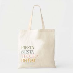 a tote bag with the word hola amigas in pink ink on it