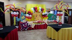 a room filled with balloons and decorations for a pokemon themed birthday party or baby shower