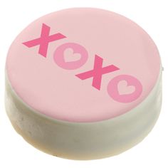 a pink and white box with the word xoxo on it's side