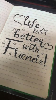 a notepad with writing on it that says life is better with friends and stars