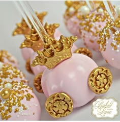 pink and gold cake pops with golden crown decorations