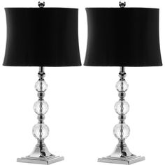 pair of crystal ball table lamps with black shade on each side and chrome finish base