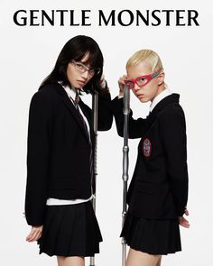 two young women in school uniforms standing next to each other