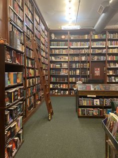 a long row of bookshelves filled with lots of books