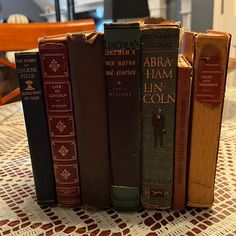 a row of books sitting on top of a table