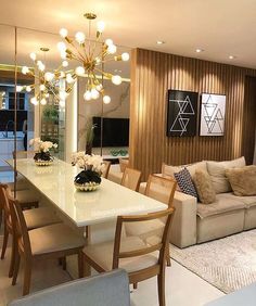 a living room filled with furniture and a white table