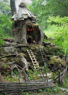 an old tree stump with a house built into it