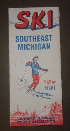 the sign is hanging on the wall in front of the door that says ski southeast michigan day or night