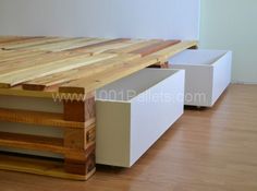 a table made out of wood and white drawers